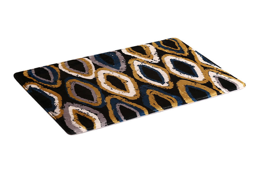 Patterned absorbent floor mat